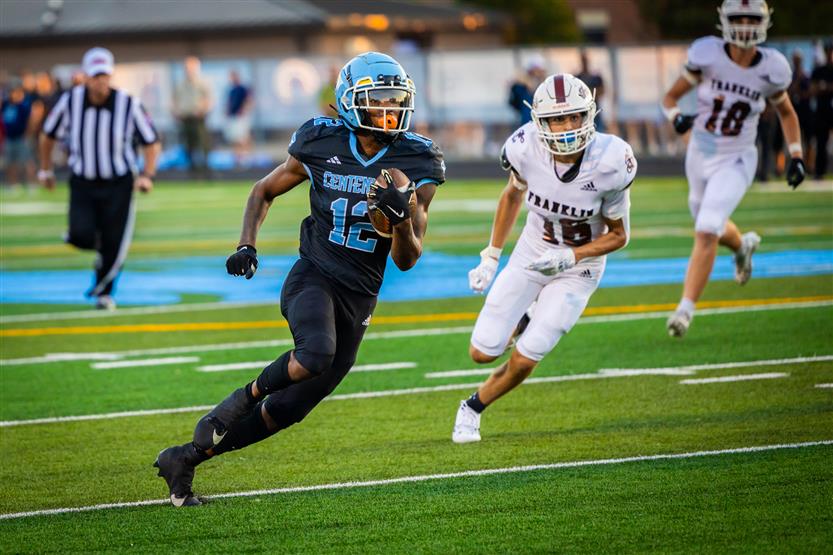Student-athletes play football